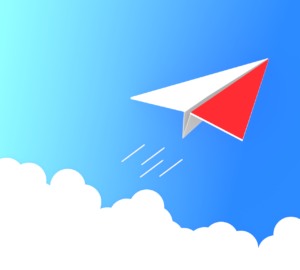 青空を飛ぶ紙飛行機のイラスト